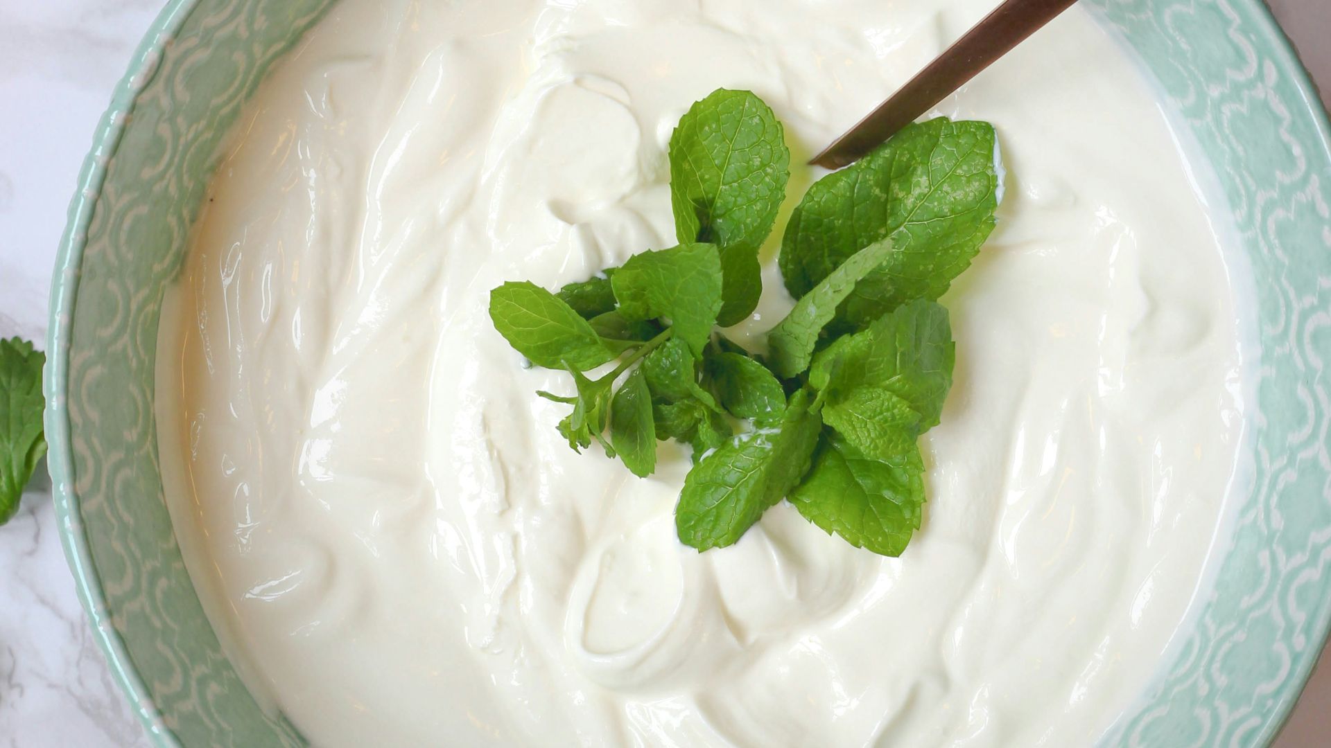 a bowl of yogurt with a spoon in it