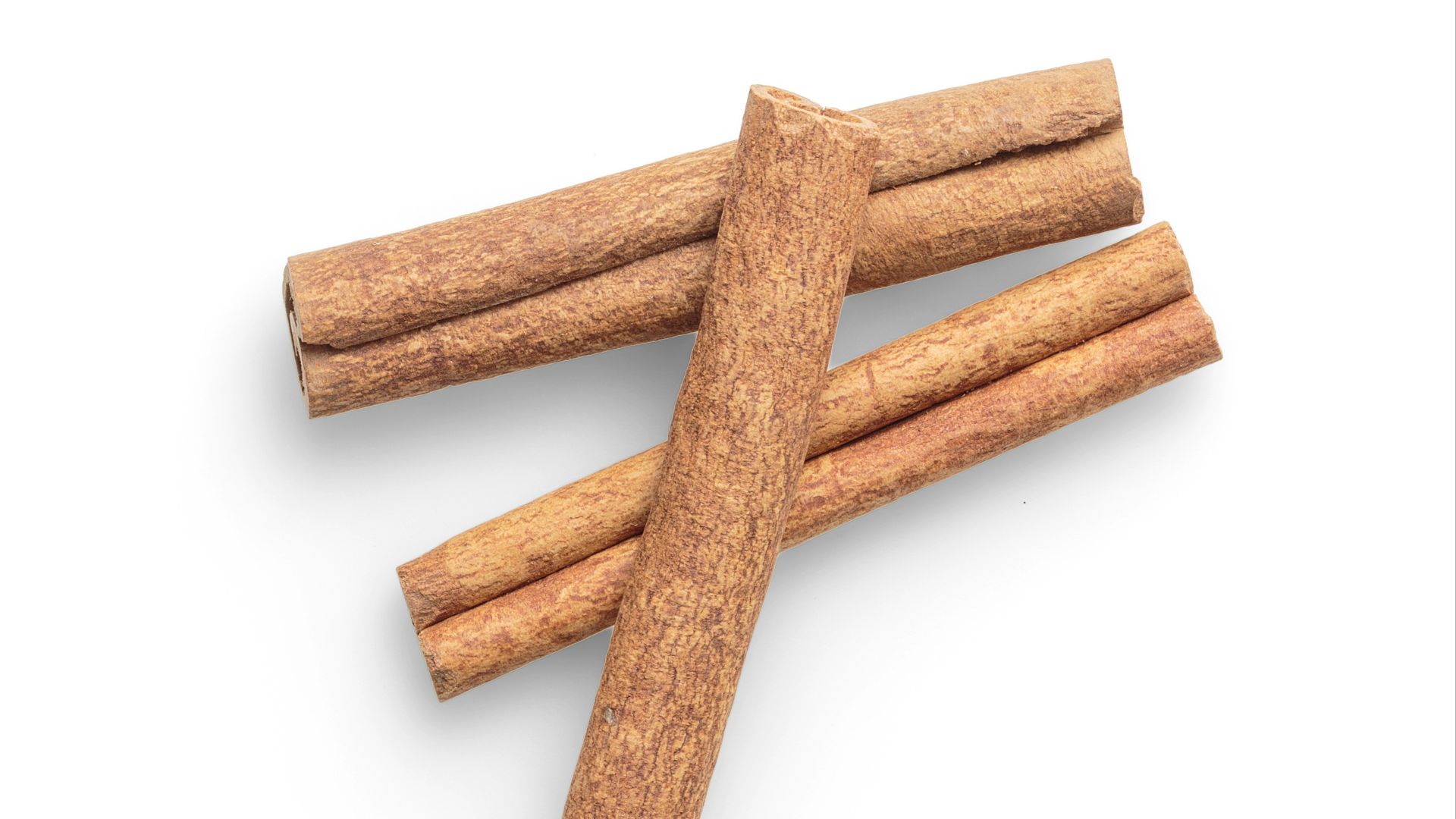 four brown biscuits on white background