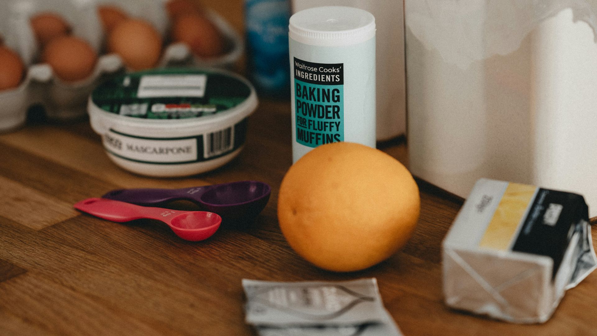 orange fruit beside white plastic bottle