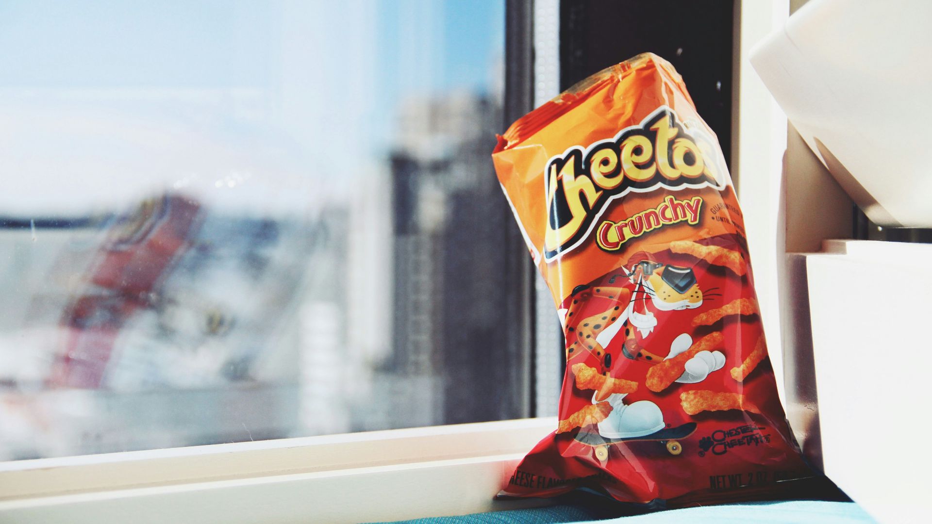 orange and yellow plastic pack on white table