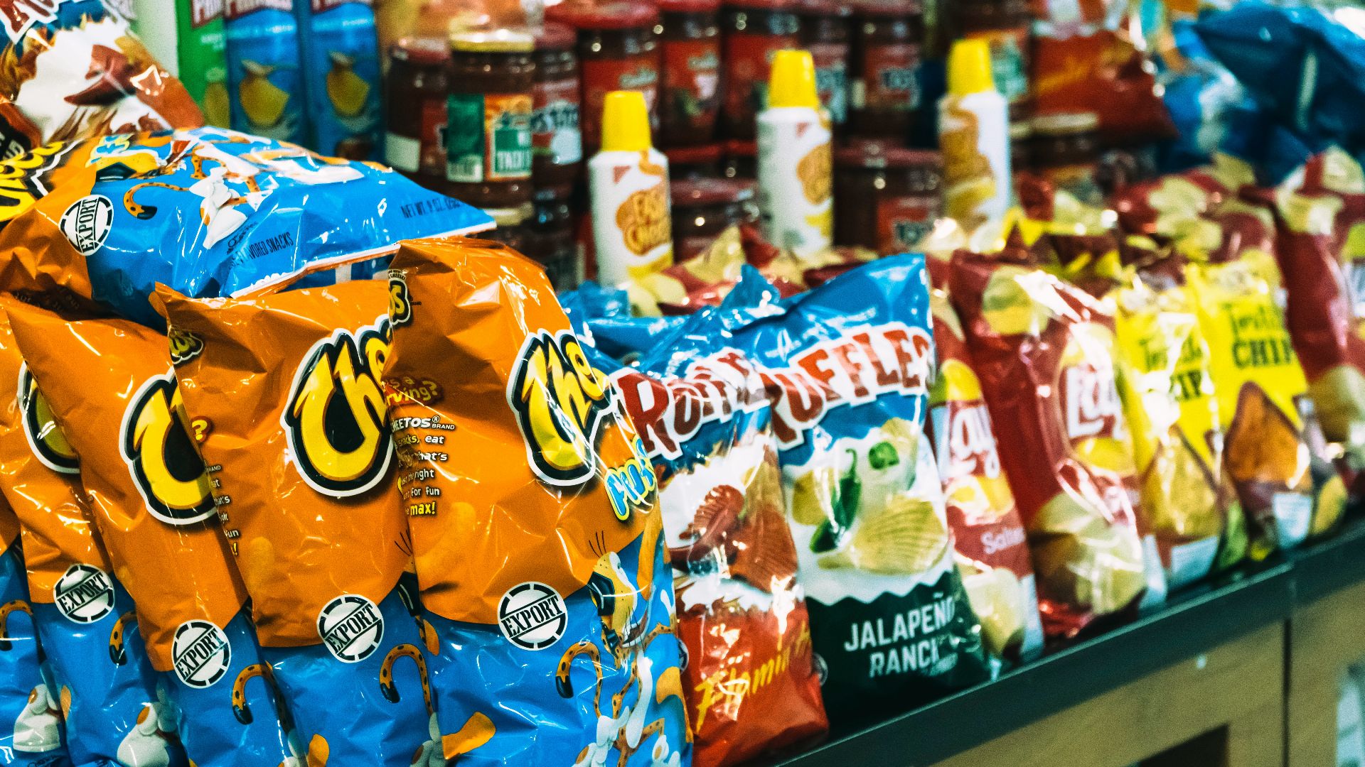 bags of chips are on display in a store