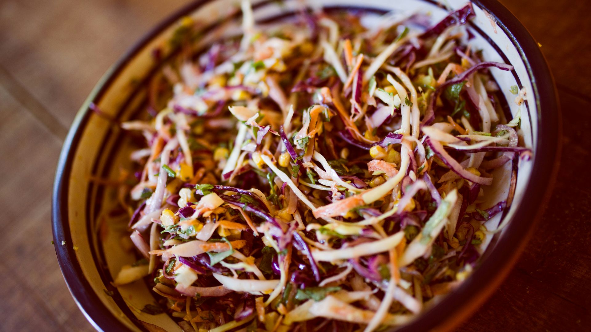 vegetable salad on white and black ceramic bowl