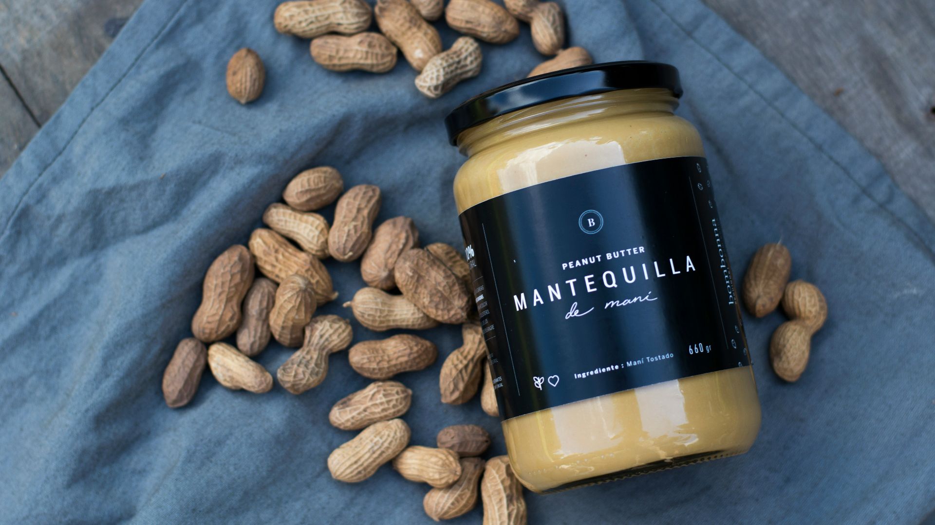 Mantequilla jar besides peanuts