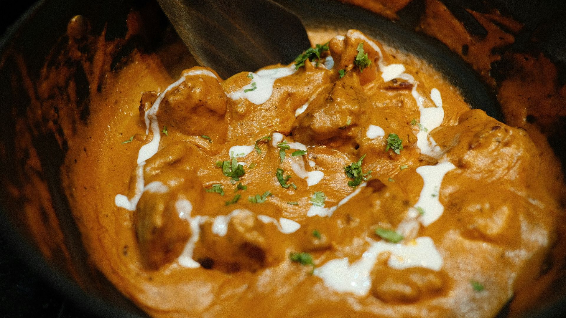 brown and green dish on brown wooden bowl