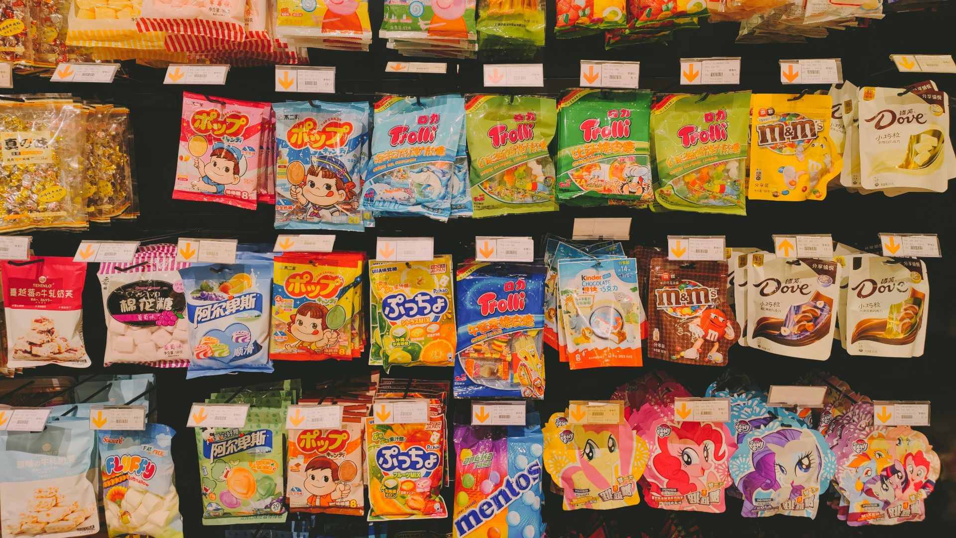 a variety of snacks are on display in a store