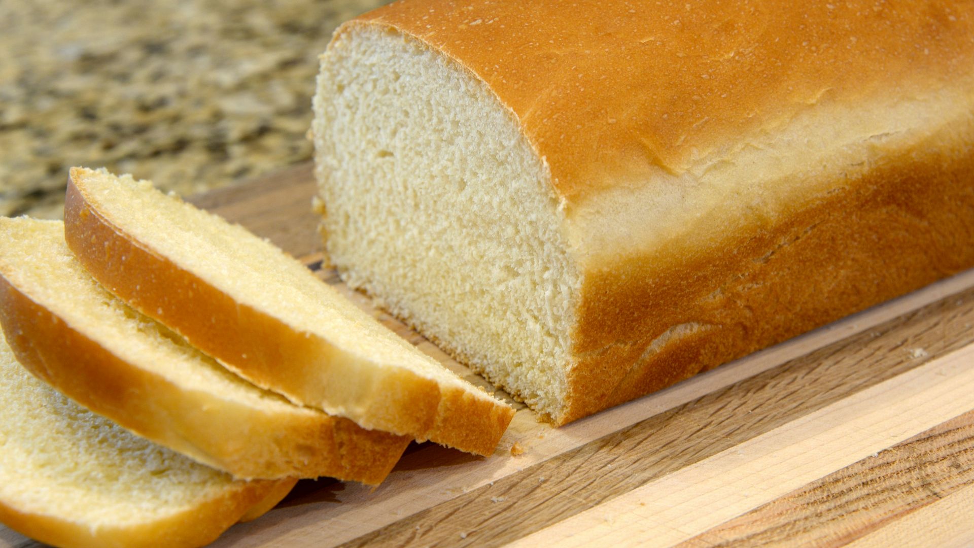 bread on brown wooden chopping board