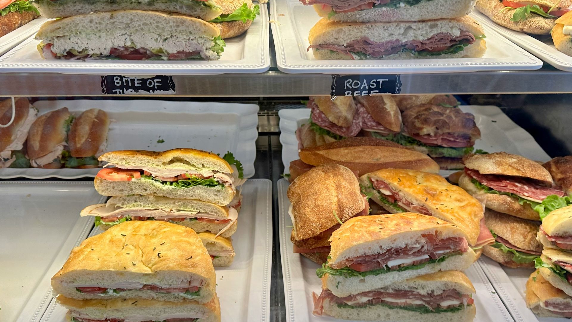 a display case filled with lots of sandwiches