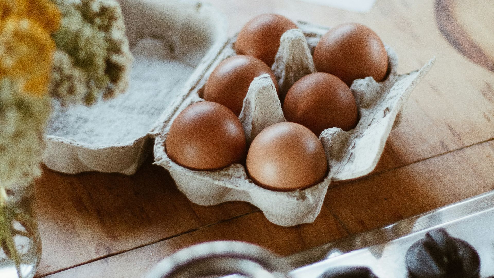 brown round fruit on stainless steel tray