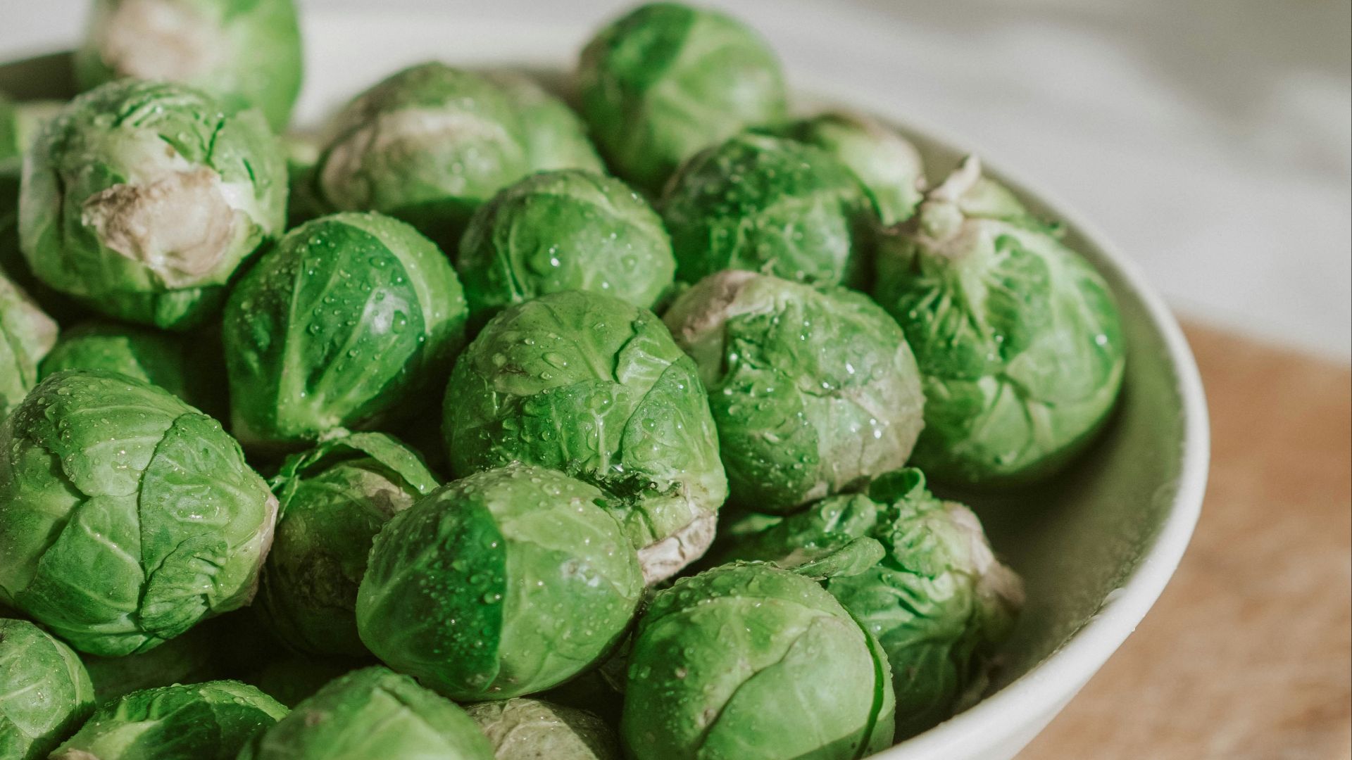 green vegetable on white ceramic bowl