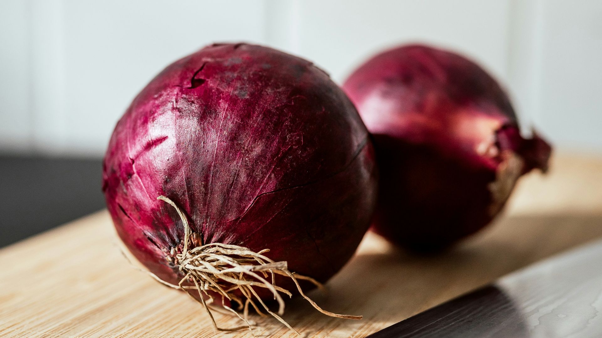 a couple of apples on a cutting board