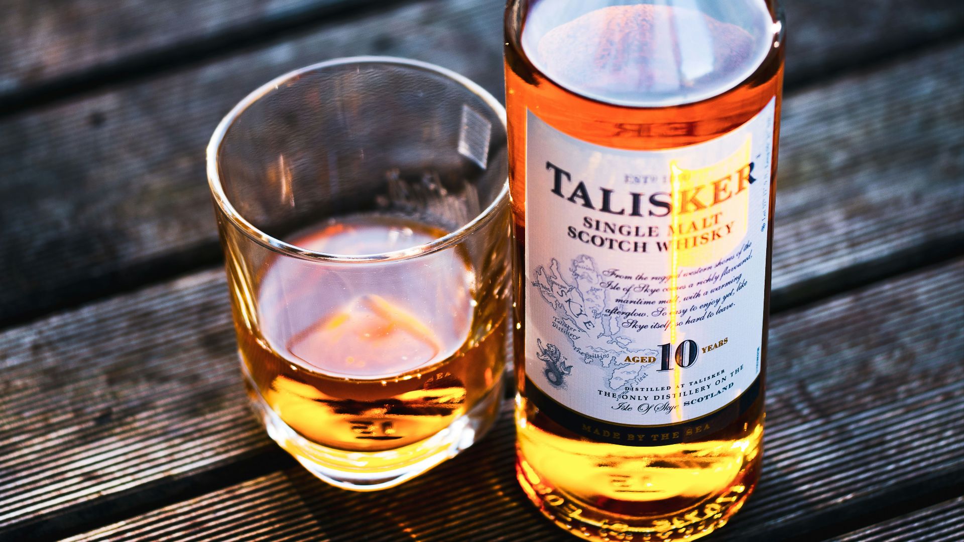 Talisker bottle beside drinking glass