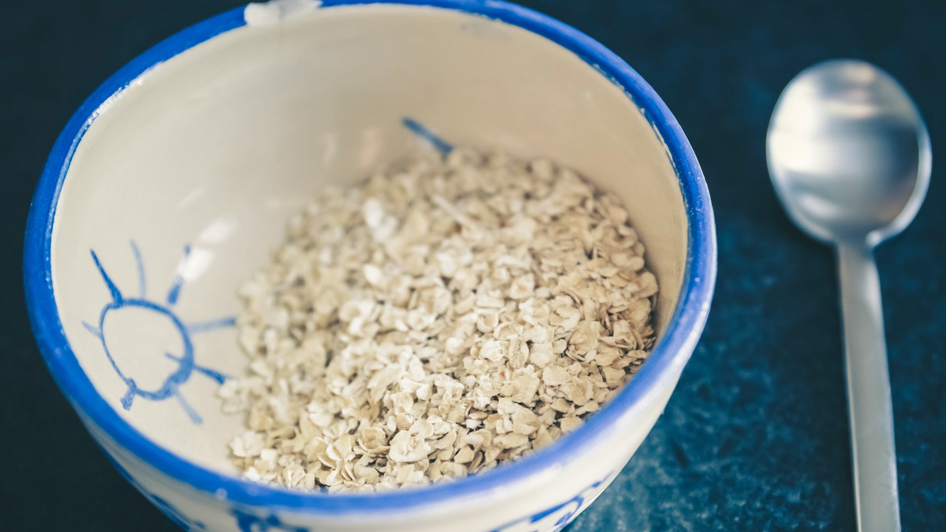 cereals in blue and white ceramic bowl