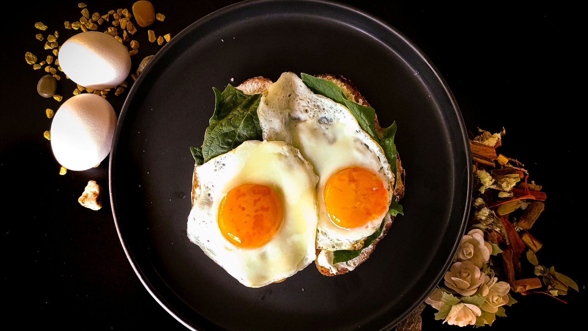 sunny side up egg on black ceramic plate