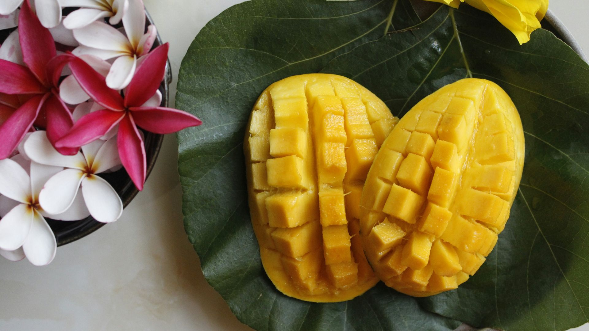 sliced mango on white ceramic plate