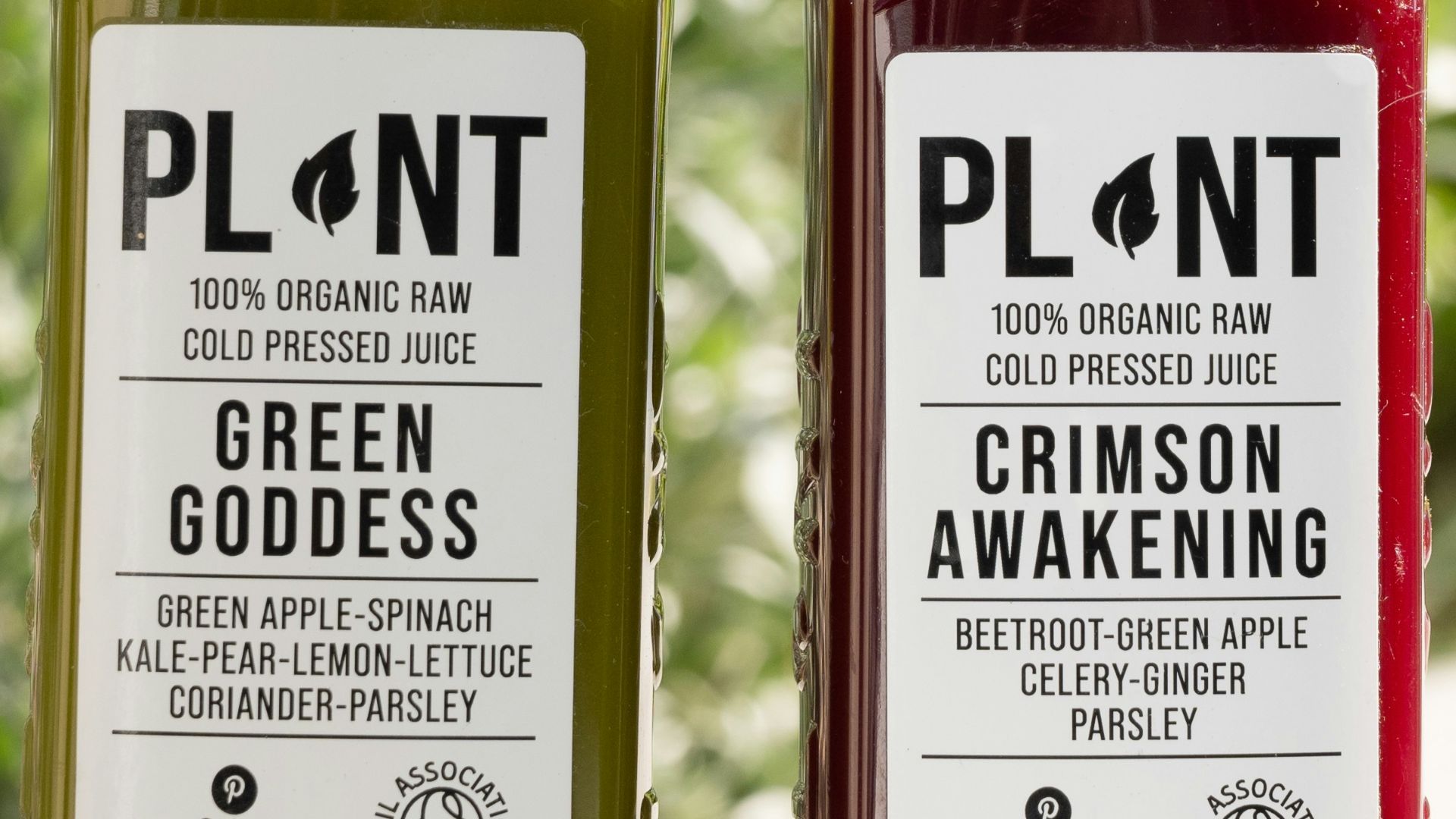 a couple of bottles of juice sitting next to each other