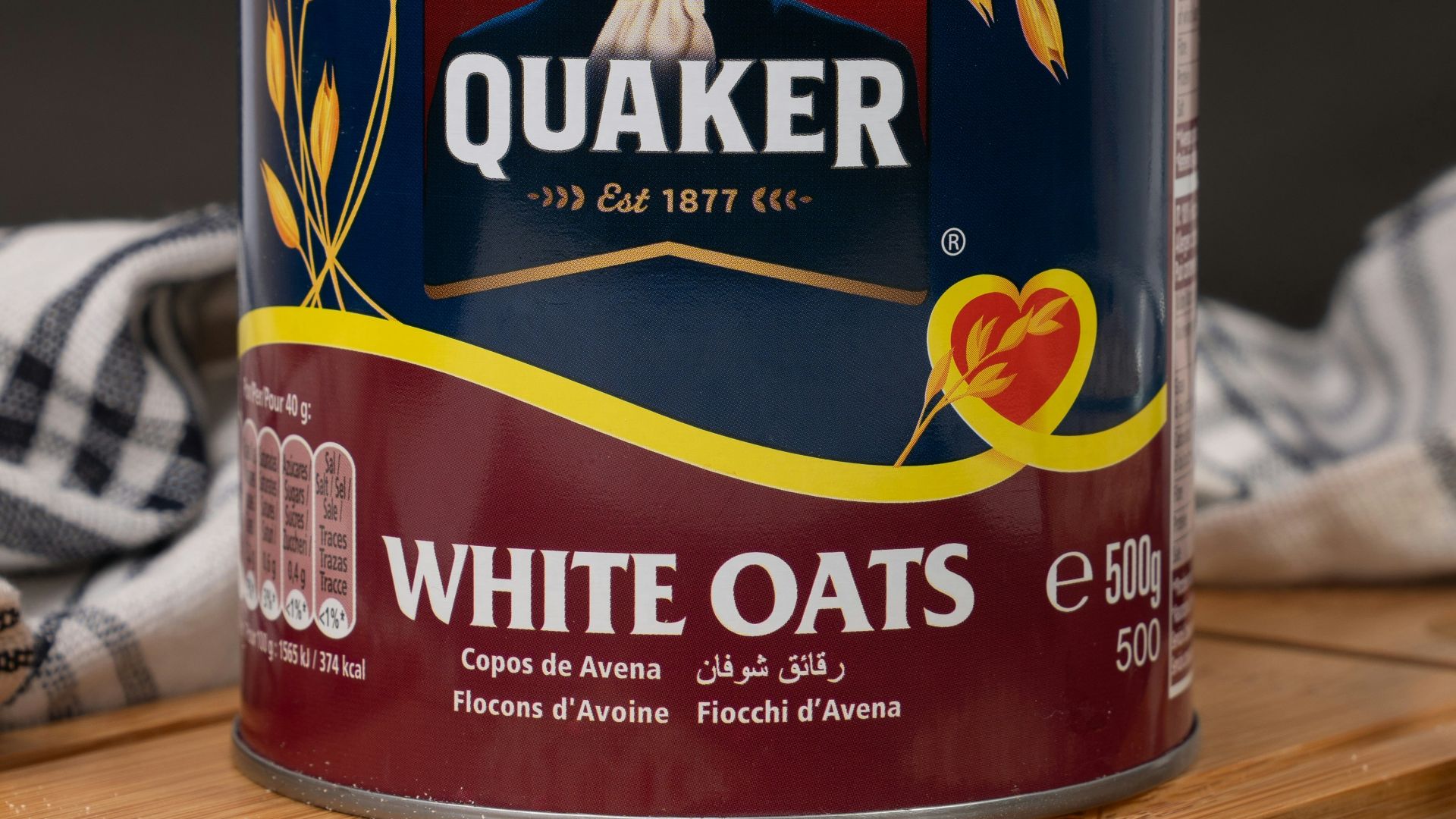 A can of oats next to a bowl of oats