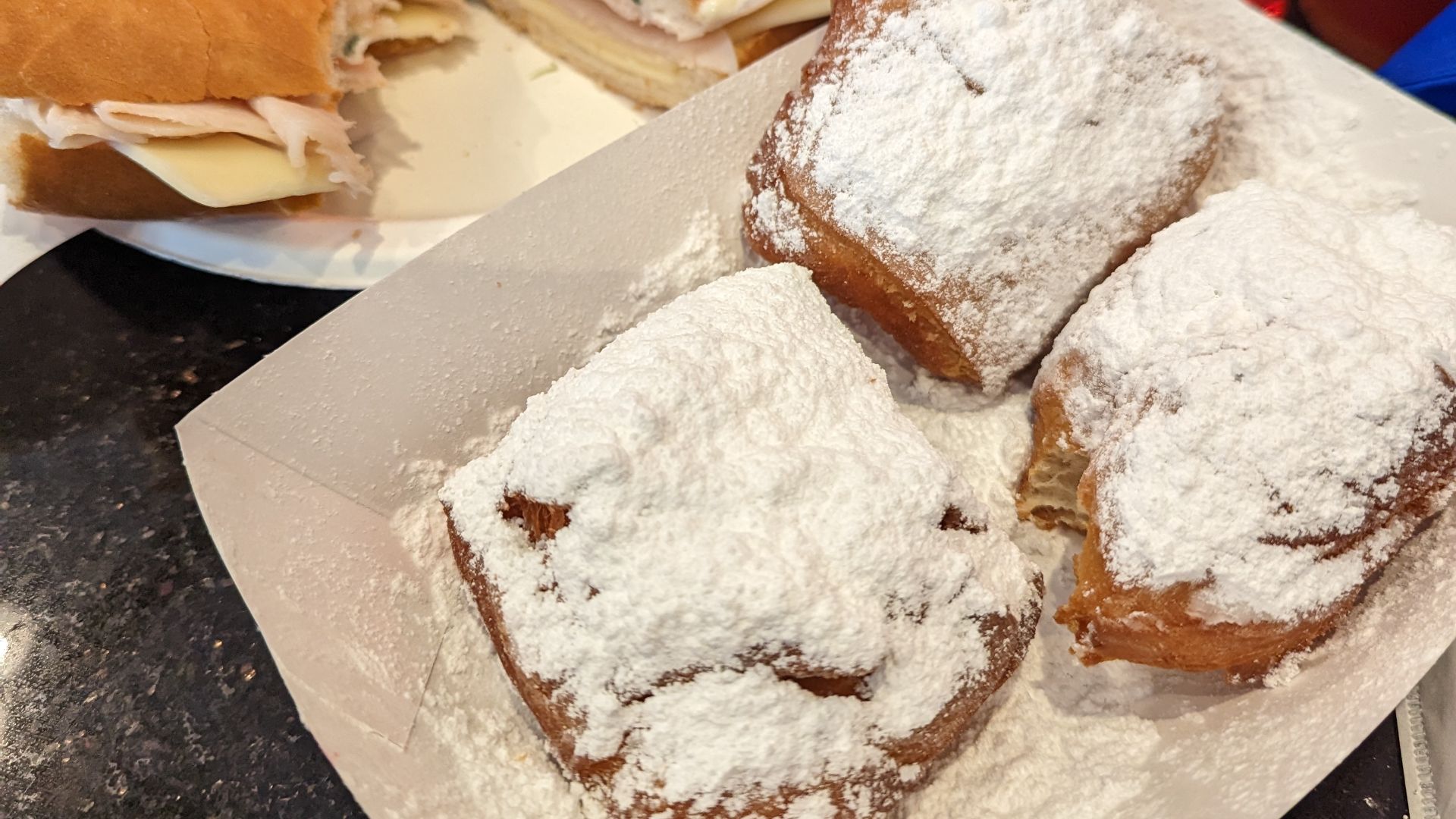File:Beignets and sandwich, New Orleans, April 2023.jpg