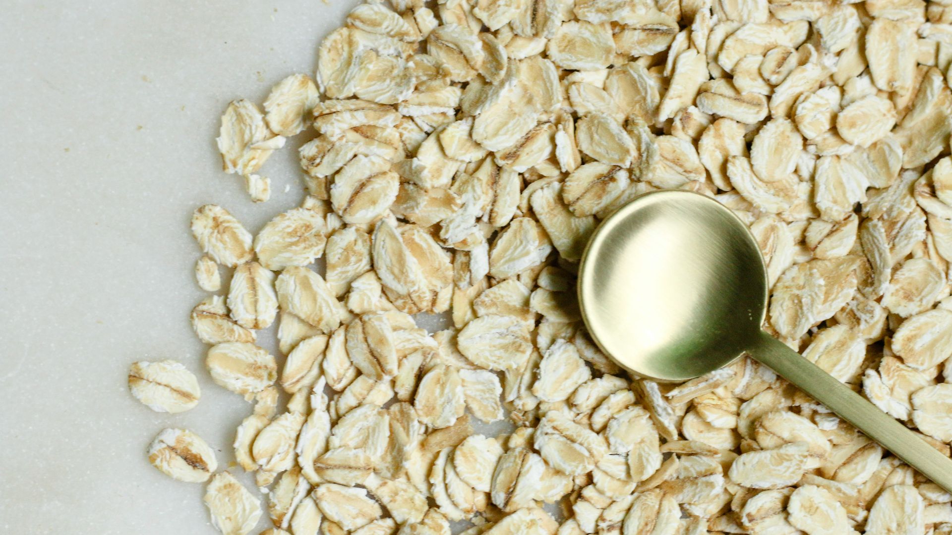 brown rice on white textile