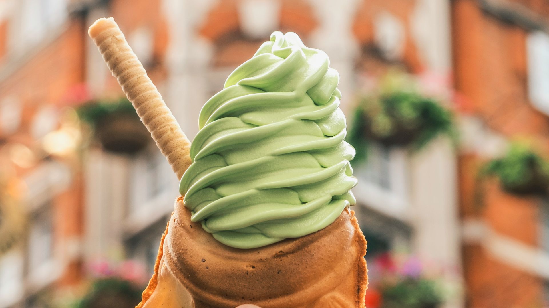 person holding brown ice cream cone