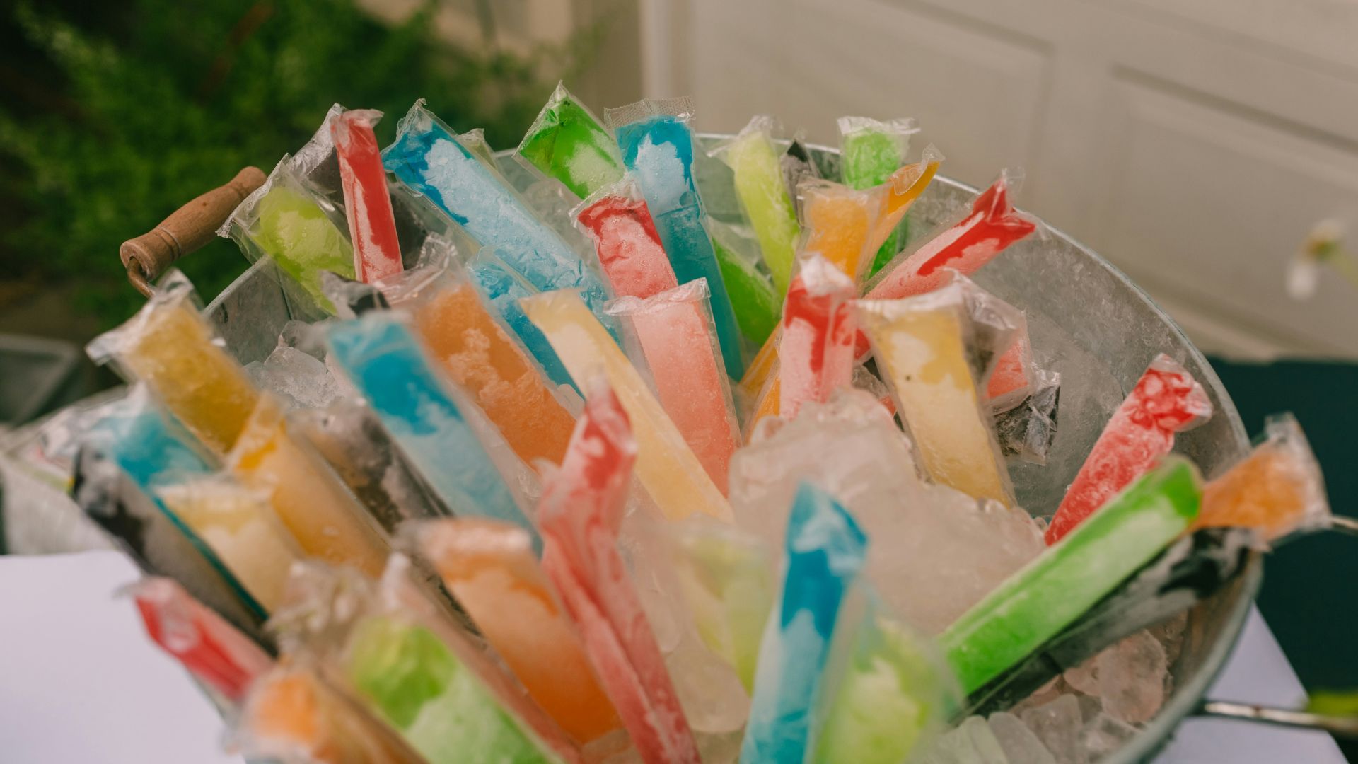 a bowl filled with lots of different colored candy sticks