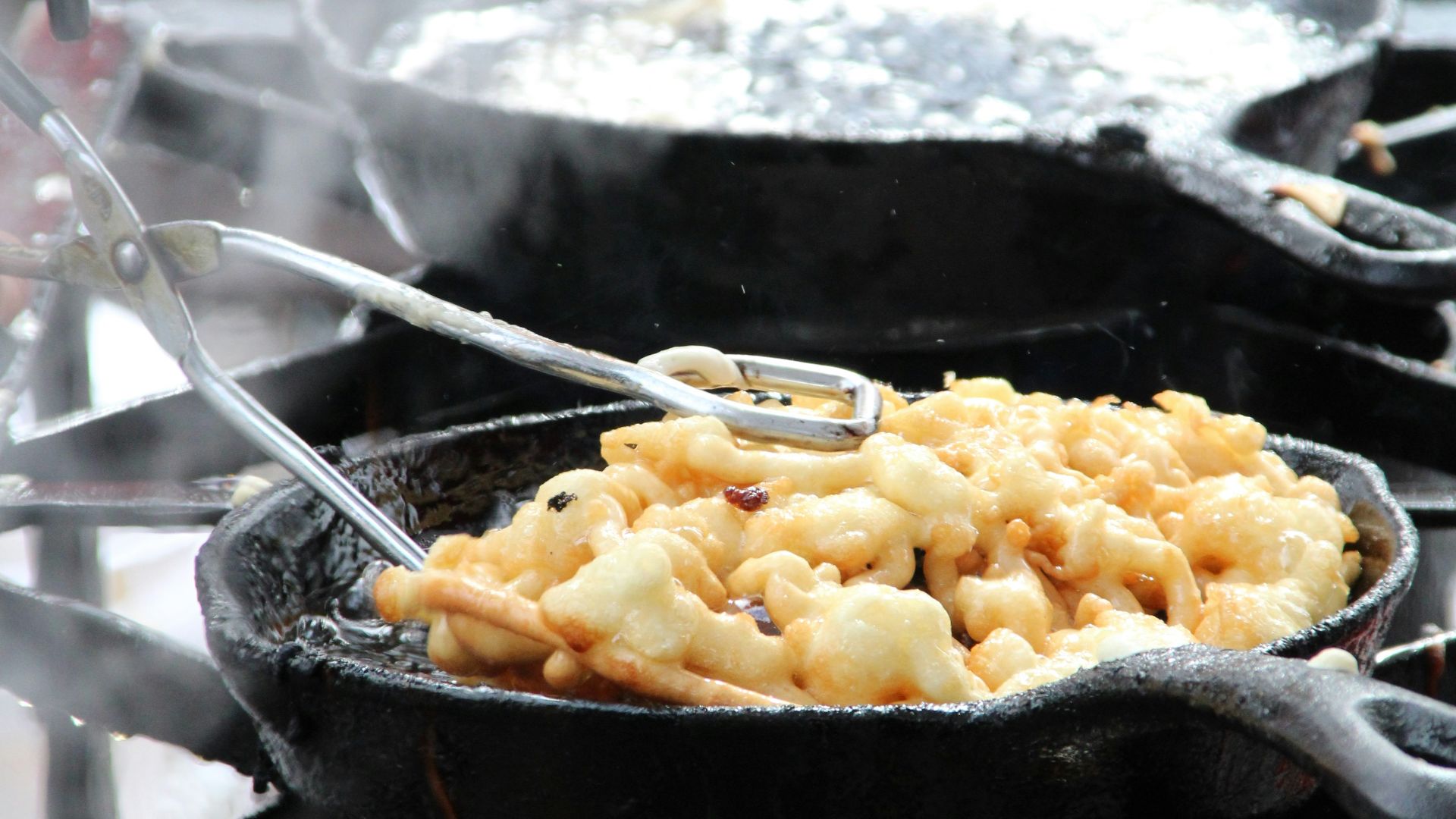 a close up of food cooking on a grill