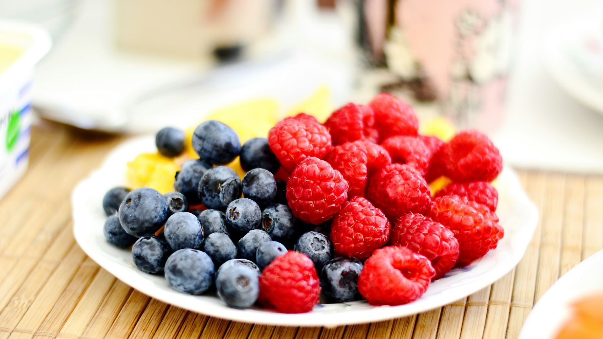 strawberries and blue berries on palte
