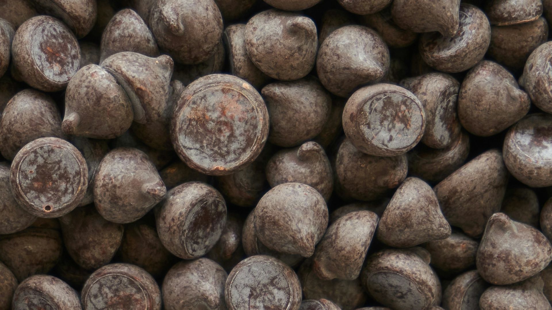 brown coffee beans on brown wooden surface