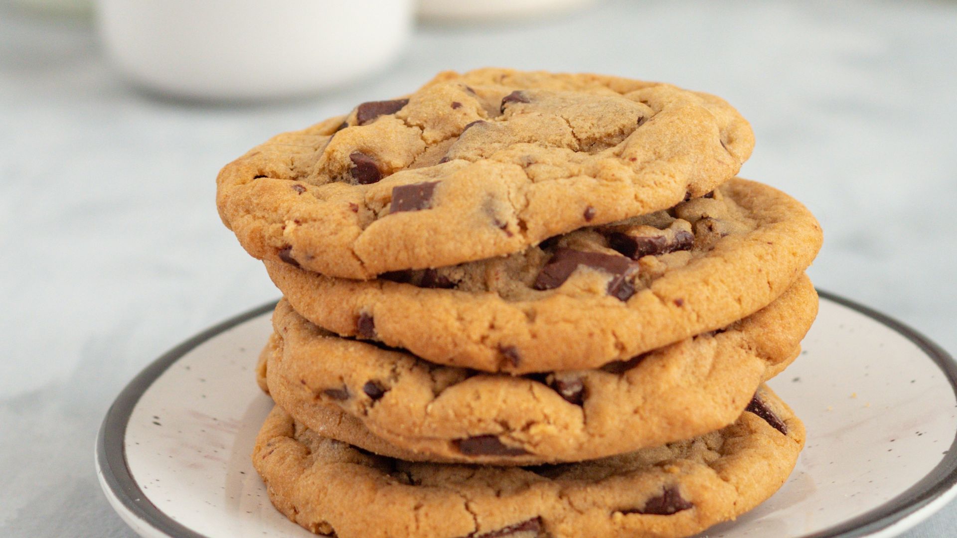 a stack of chocolate chip cookies on a plate