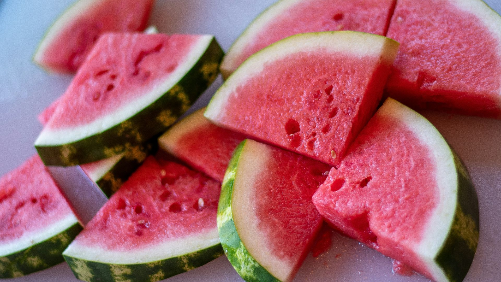 sliced watermelon on white plate