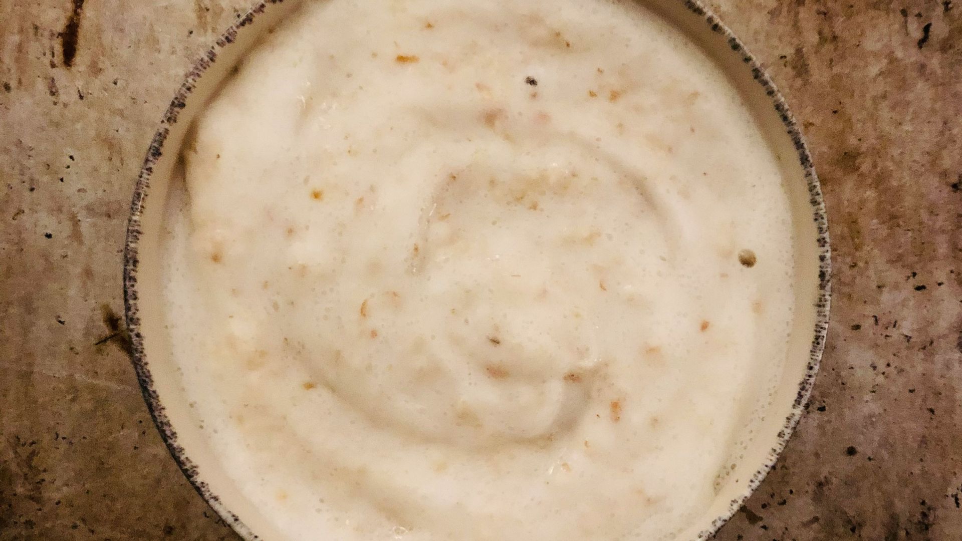 a bowl of food sitting on top of a table
