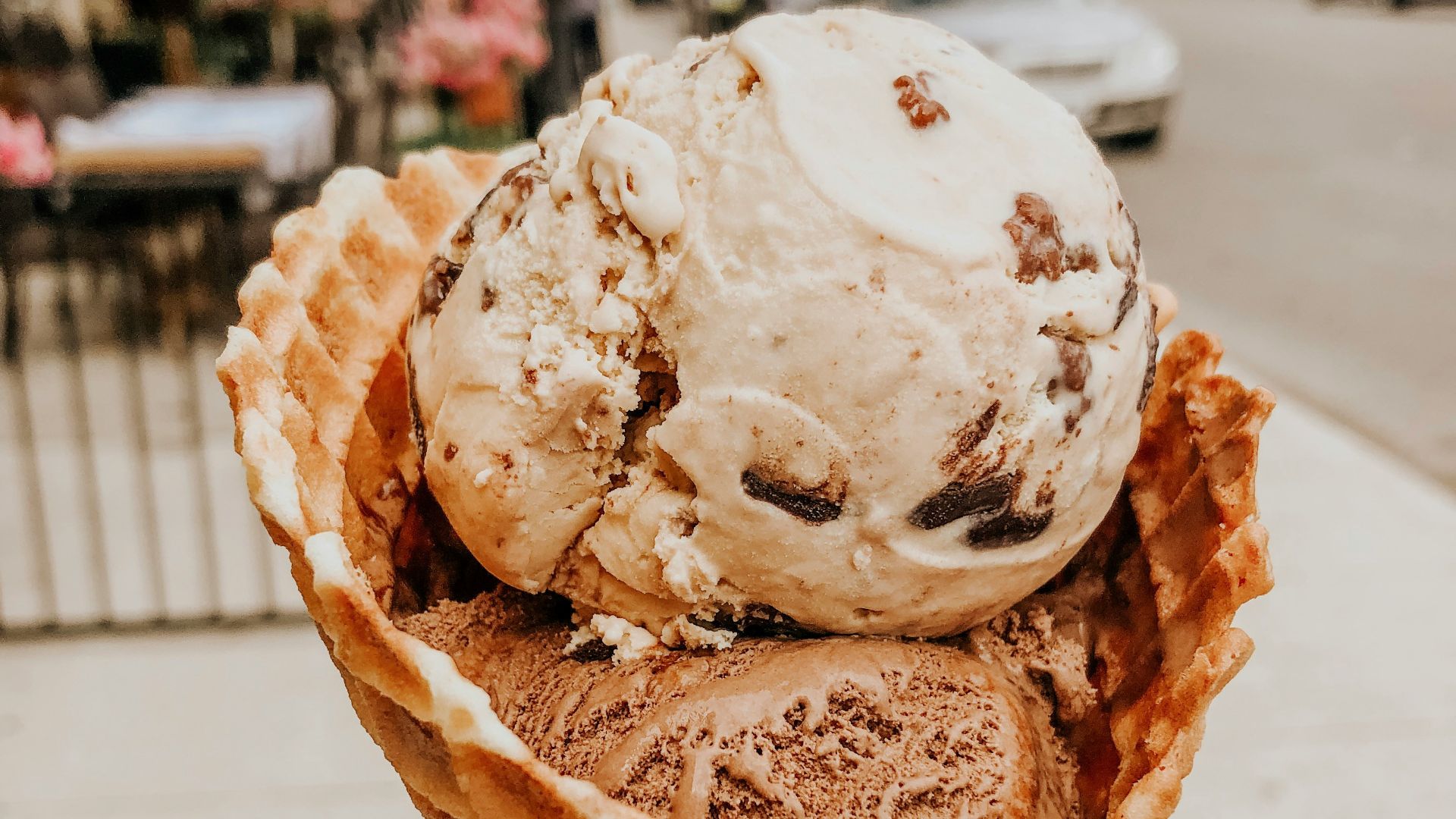person holding ice cream in cone