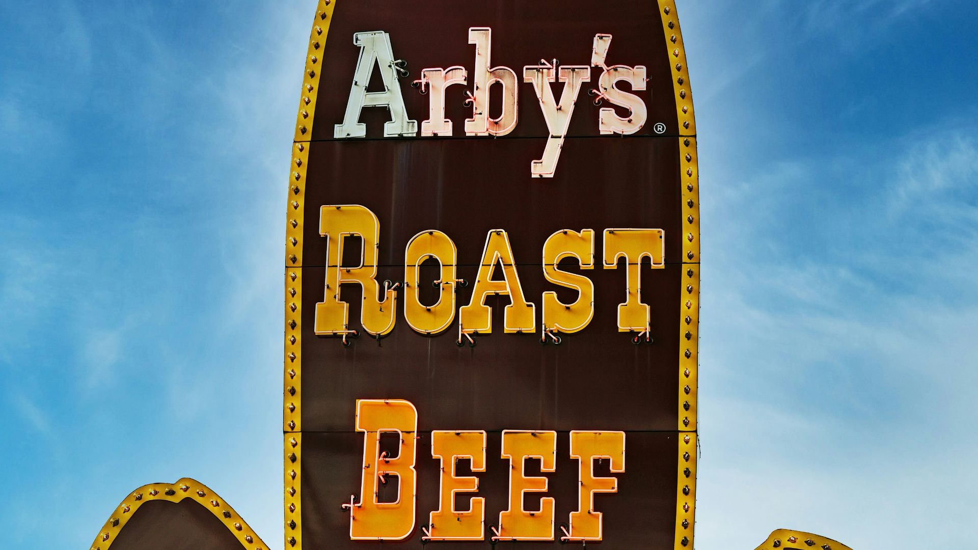 A sign for a restaurant called andy's roast beef sandwich