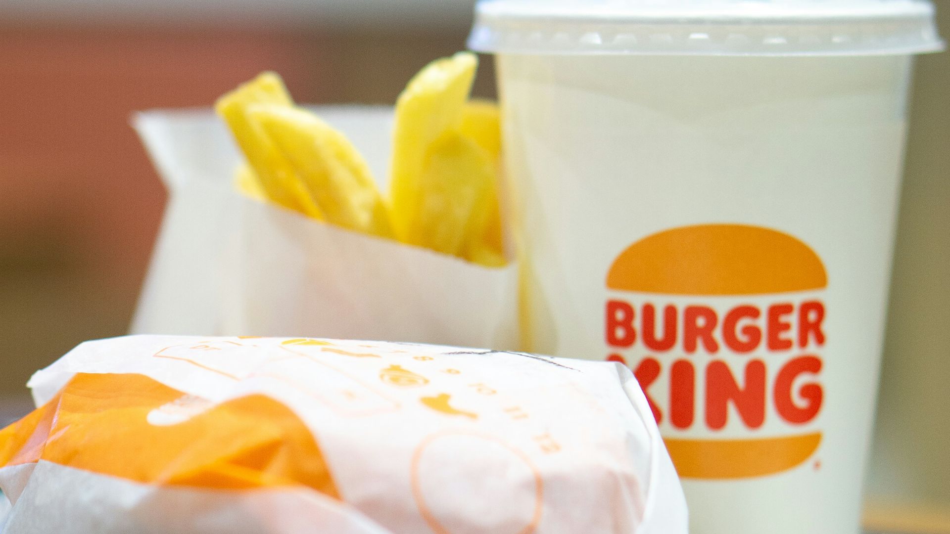 a plate with a sandwich and a cup of coffee