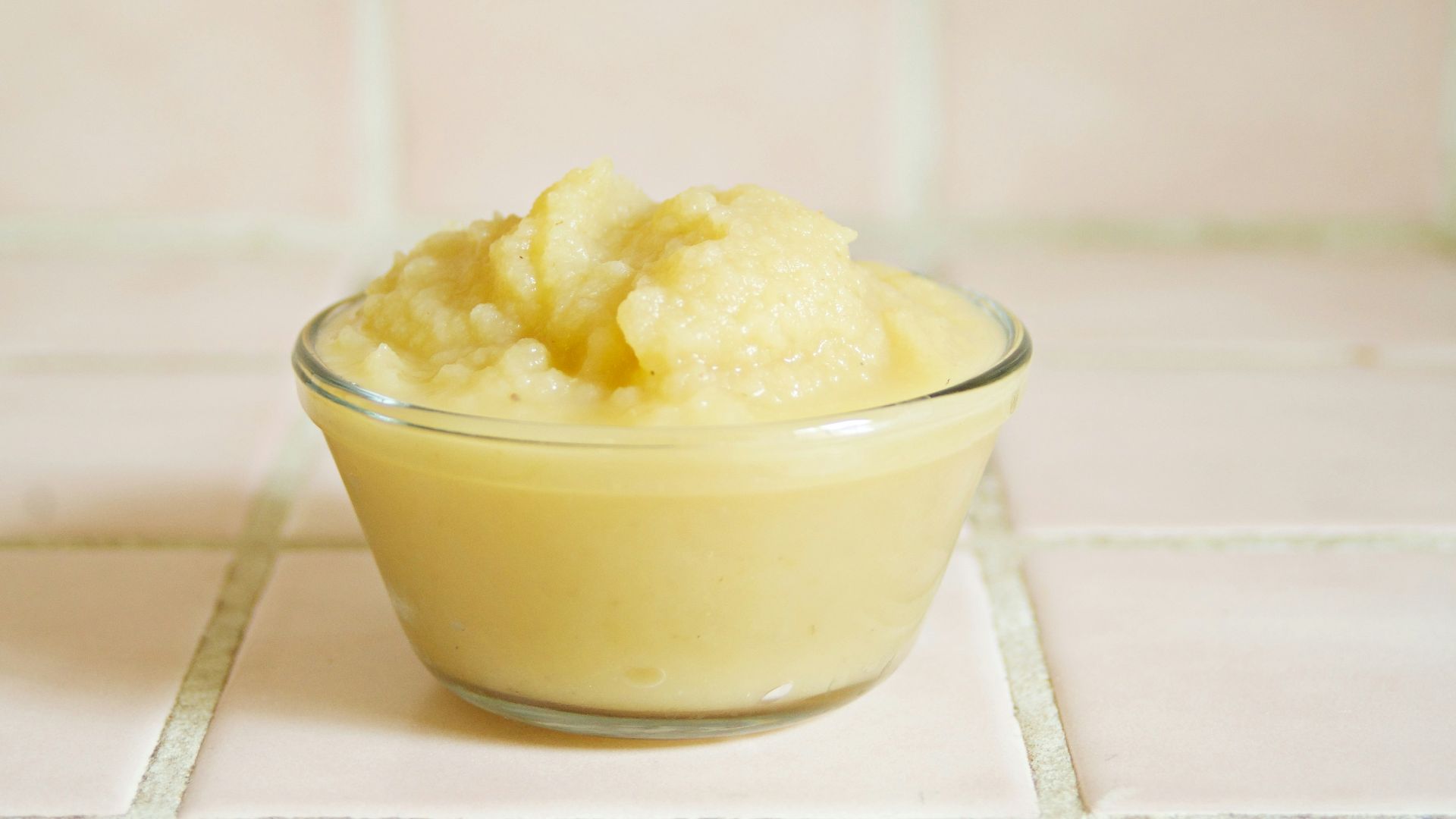 yellow cream in clear glass bowl