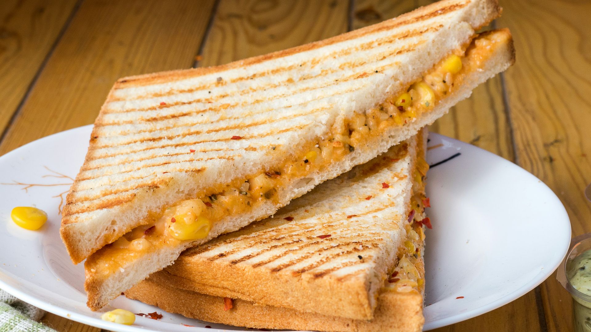 bread with cheese fillings on white ceramic plate