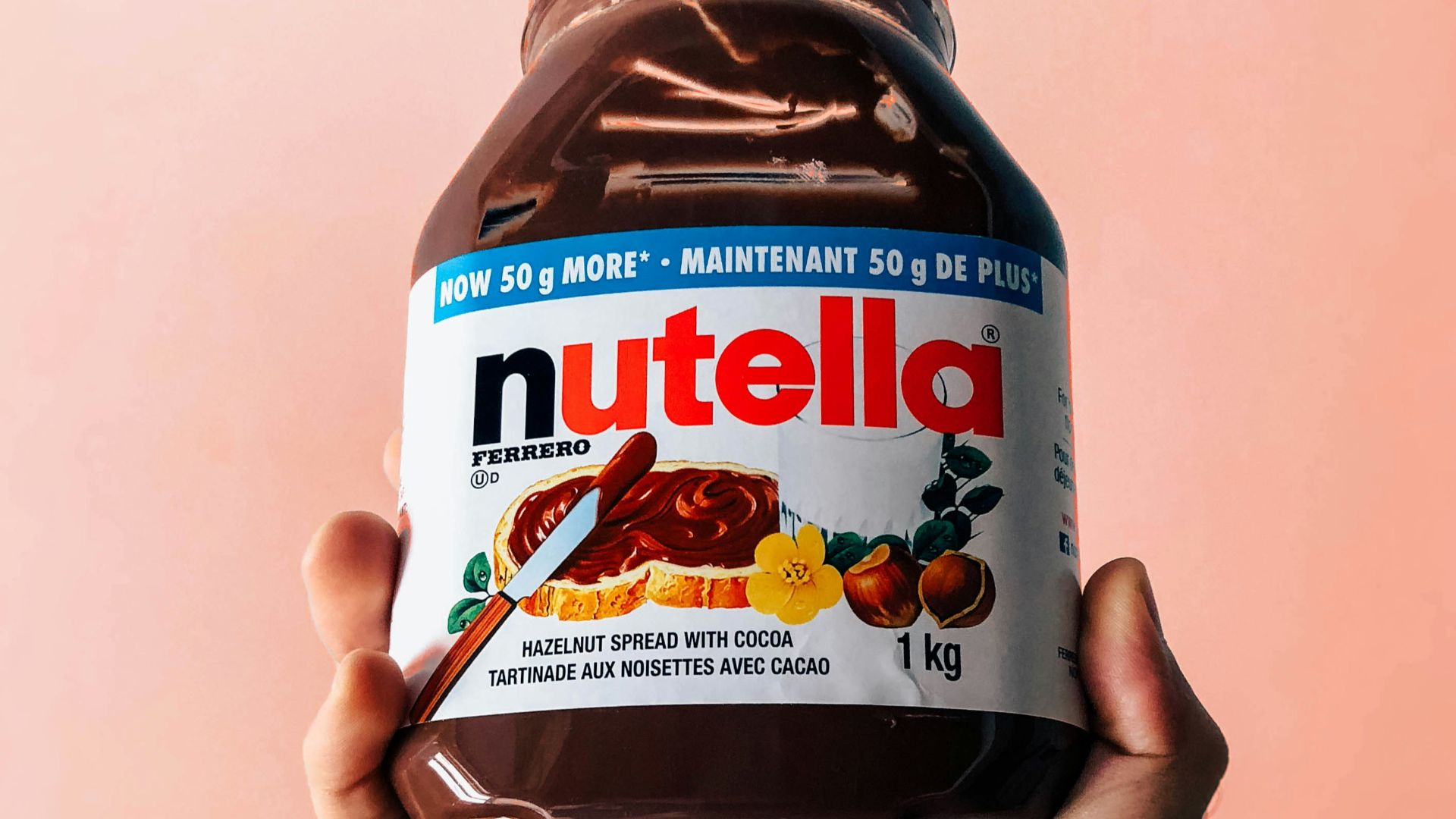person holding Nutella jar