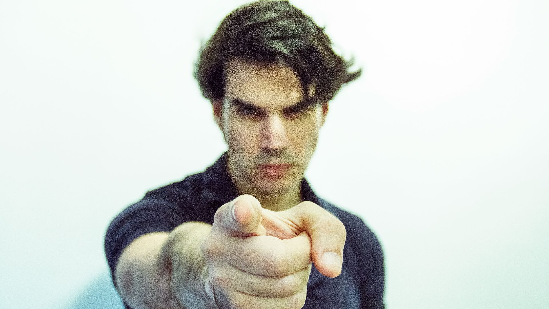 man pointing at camera