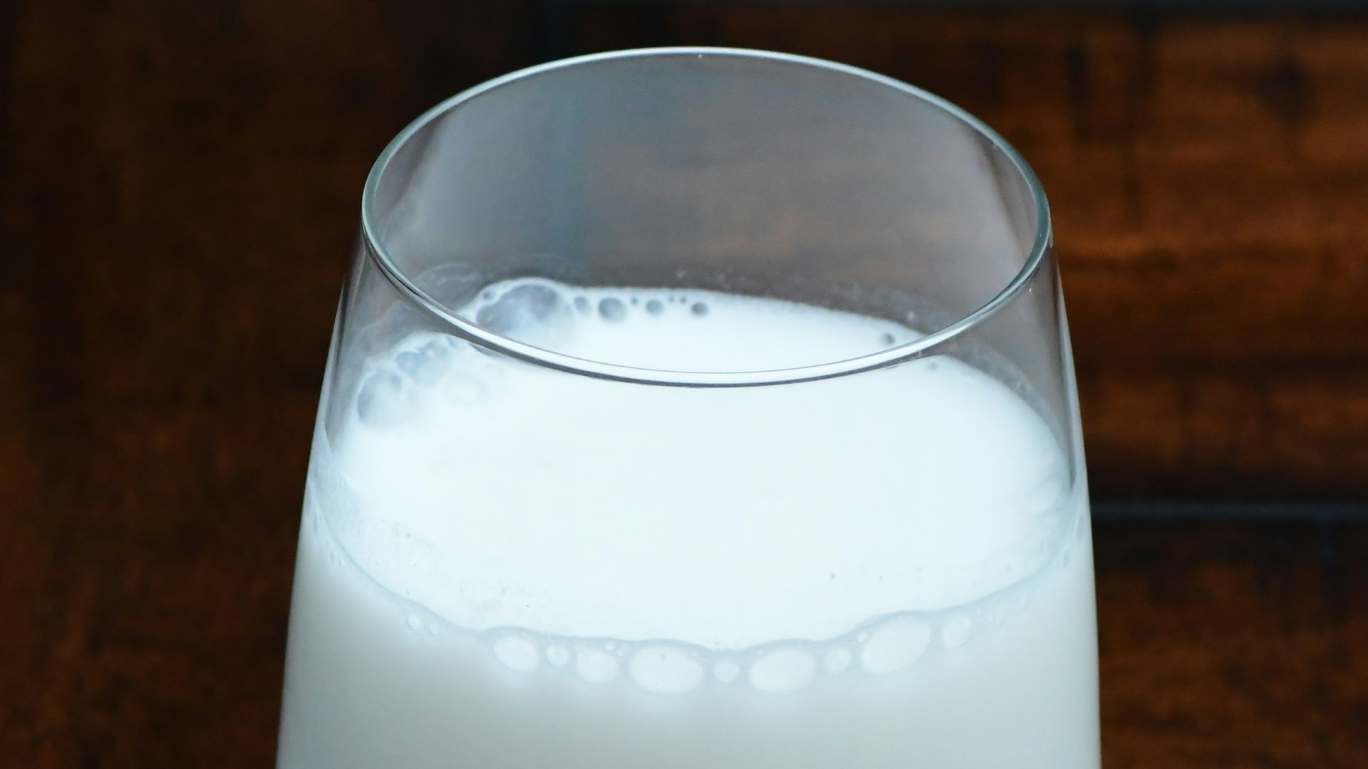 clear drinking glass with white liquid