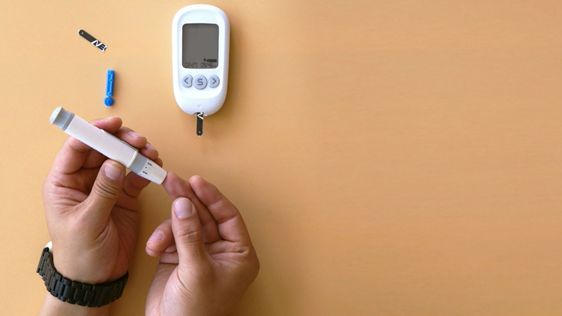 a person holding a thermometer next to an electronic device