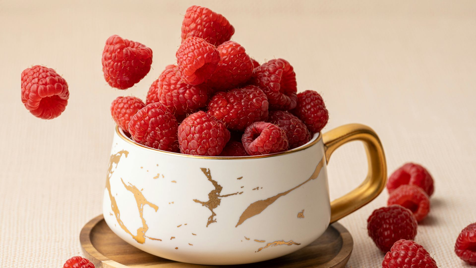 a cup of coffee with raspberries on top
