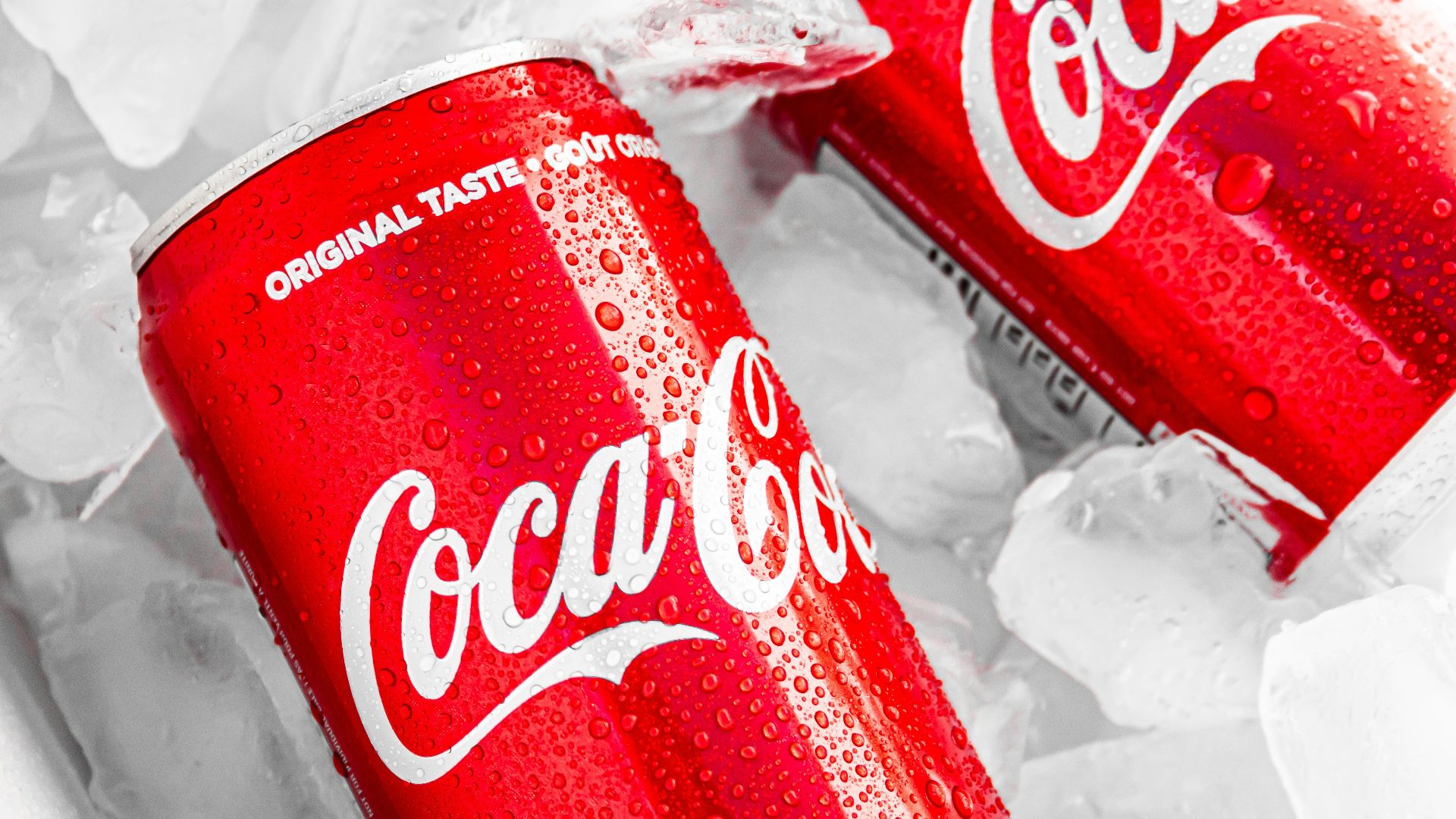 coca cola can on white plastic pack