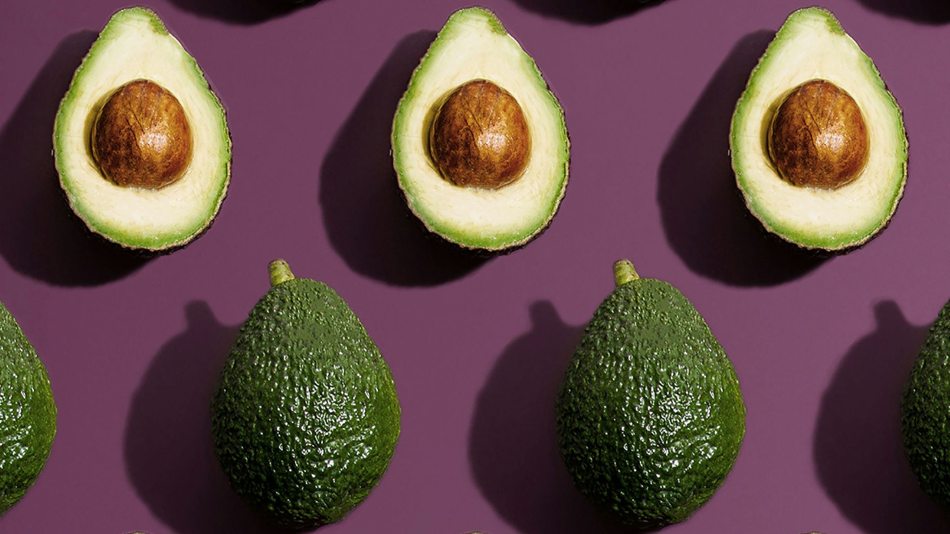 sliced green fruit on purple background