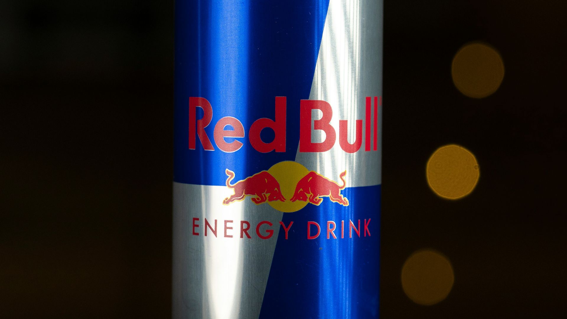 a can of red bull energy drink sitting on a table