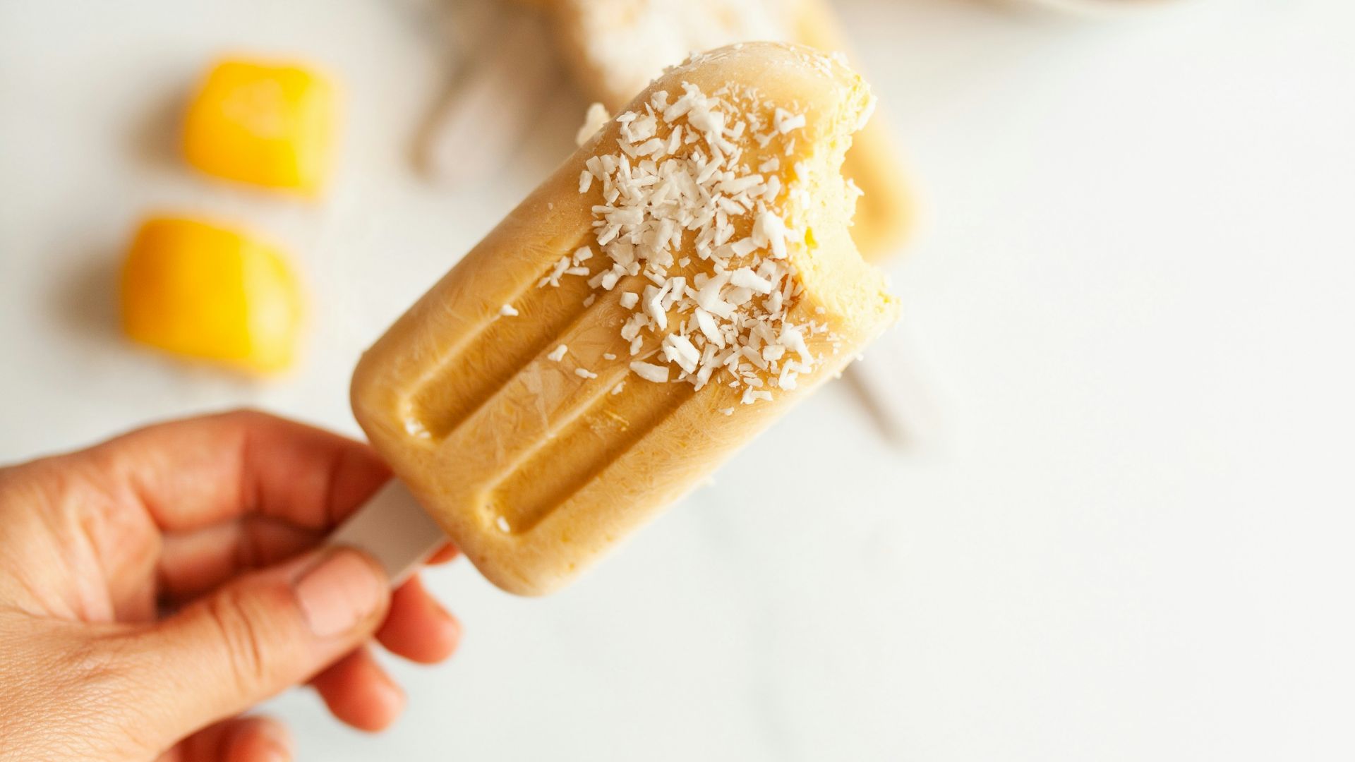 person holding brown and white food