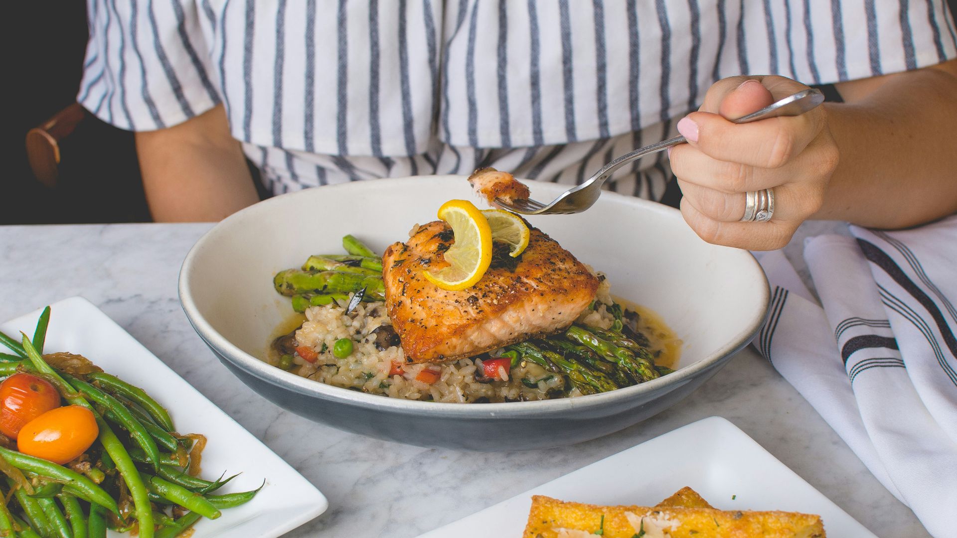 person eating fish meat