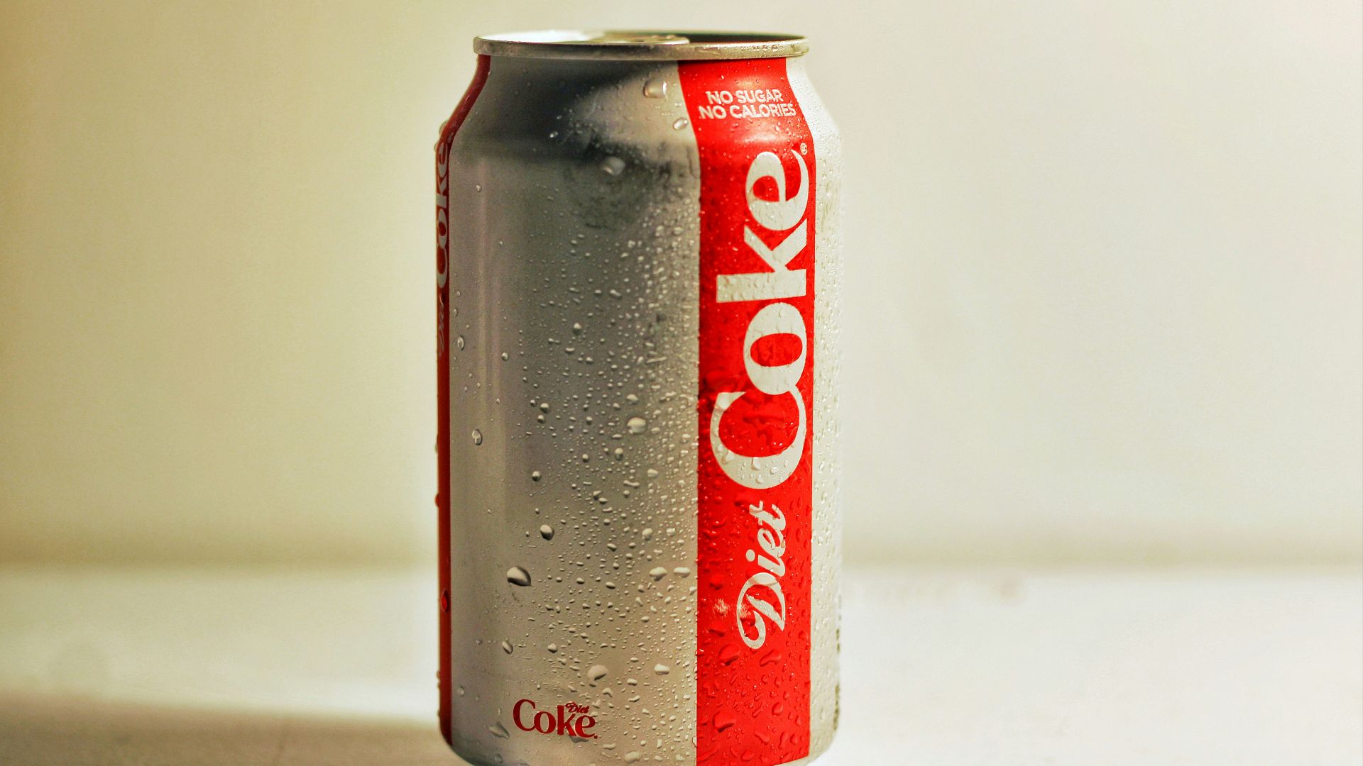 diet coke can on white table