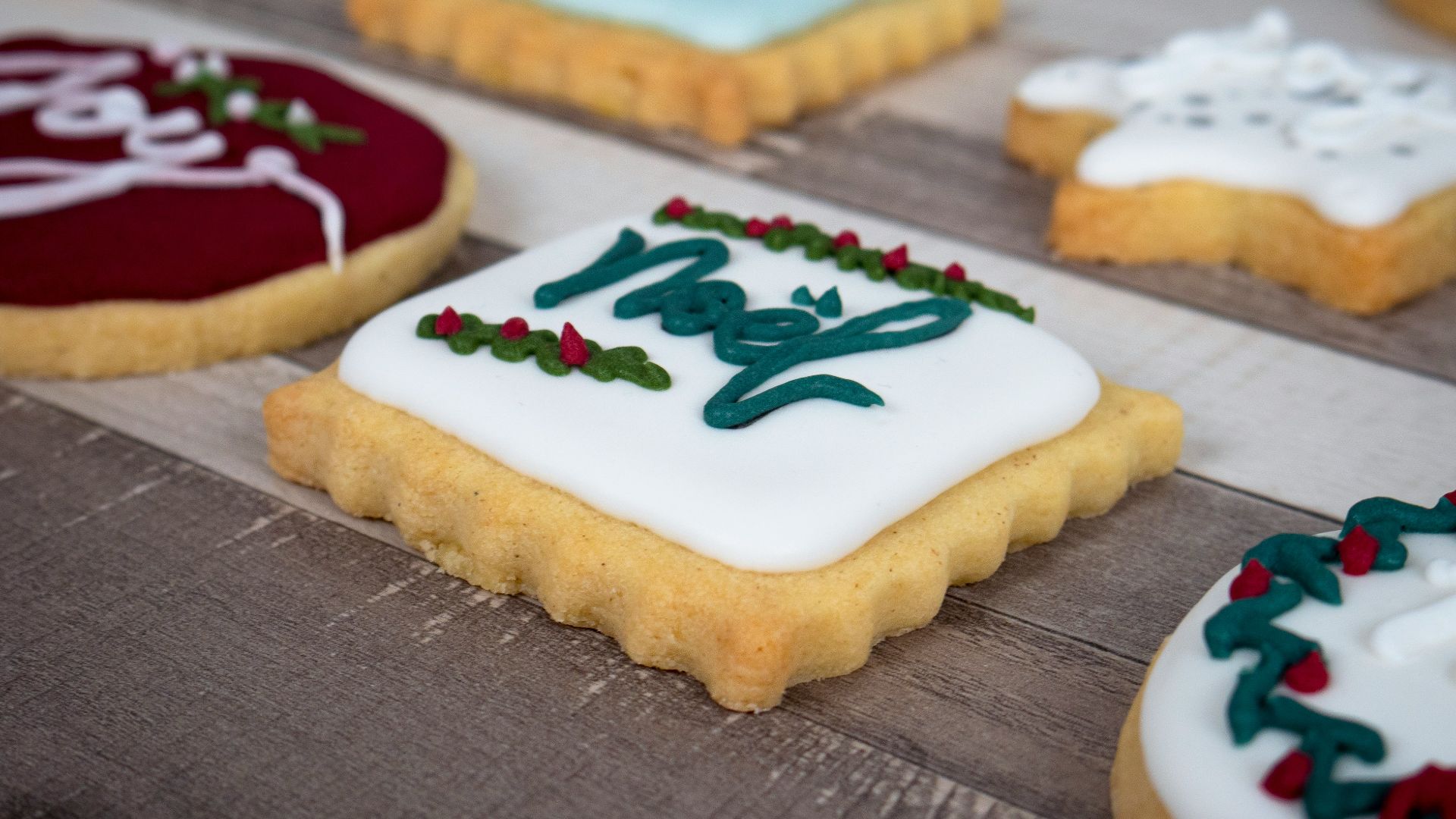 white and brown cupcake with strawberry on top