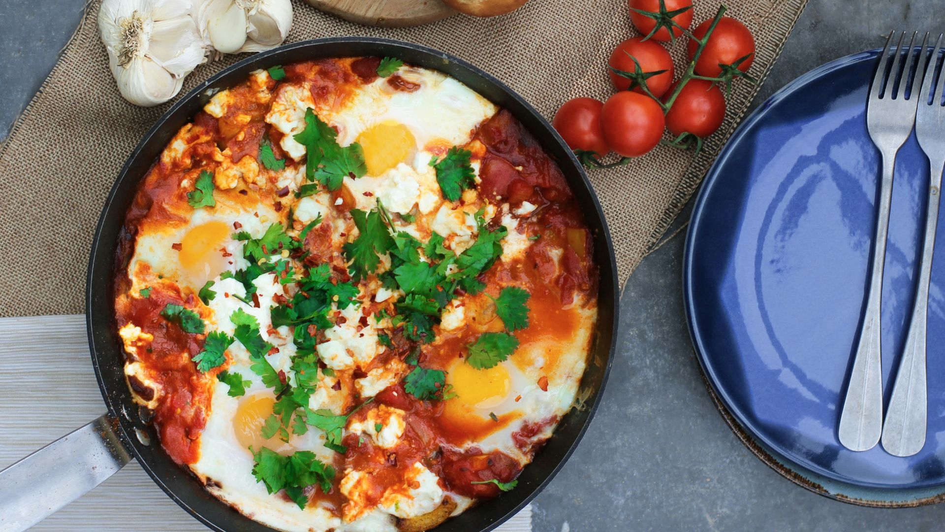steam pasta beside tomatoes and plate