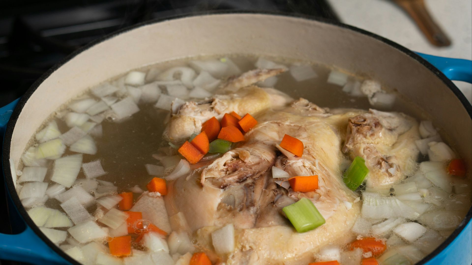 white rice with green peas and carrots in blue ceramic bowl