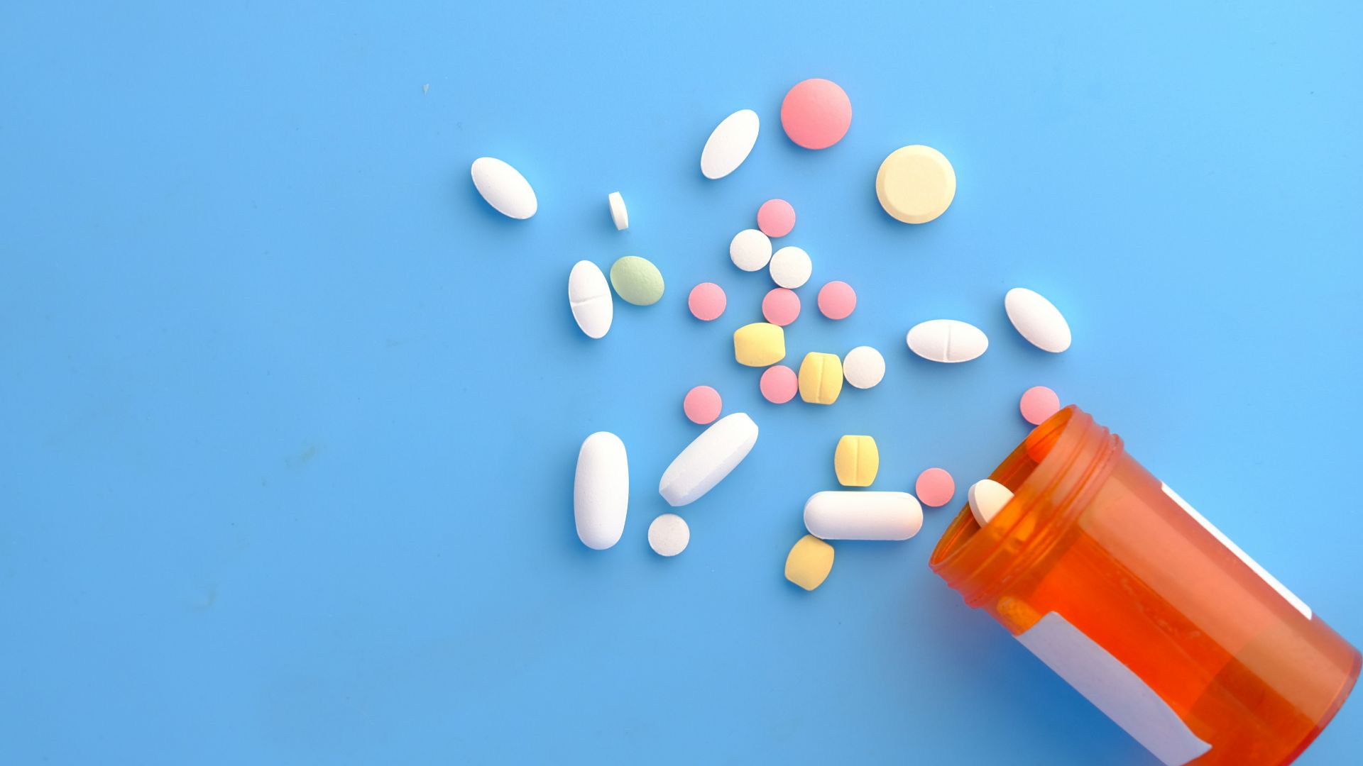 orange and white medication pill